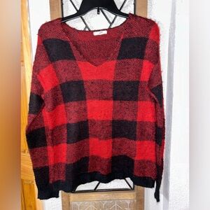 Maurice Eed and black checked sweater